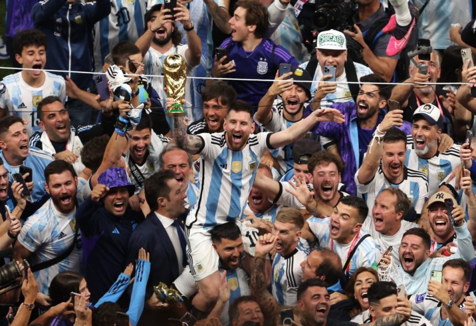 LUSAIL CITY, QATAR - DECEMBER 18: Lionel Messi of Argentina celebrates with the world cup trophy following his sides victory  during the FIFA World Cup Qatar 2022 Final match between Argentina and France at Lusail Stadium on December 18, 2022 in Lusail City, Qatar. (Photo by Alex Pantling/Getty Images)